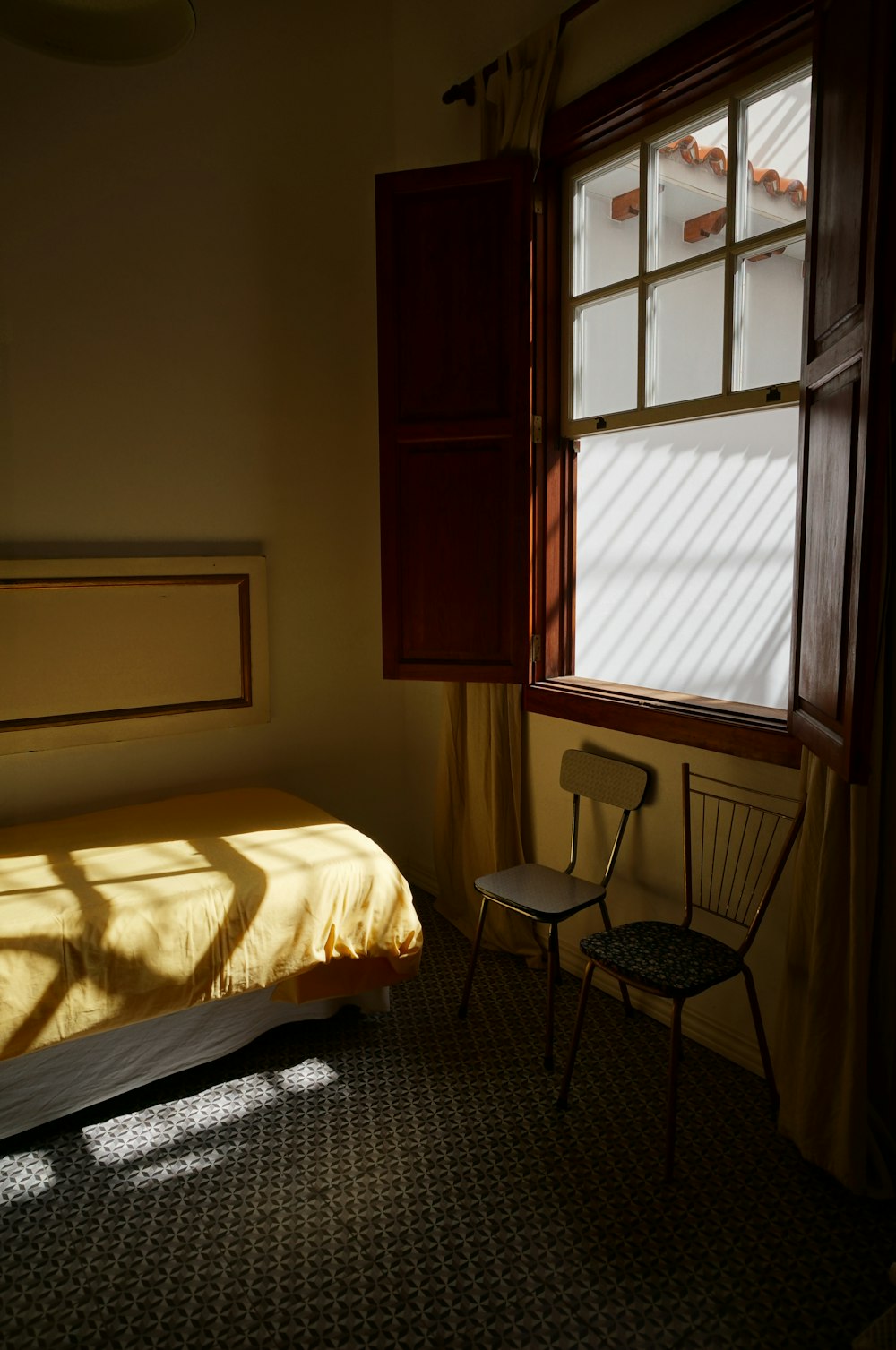 white bed linen near window
