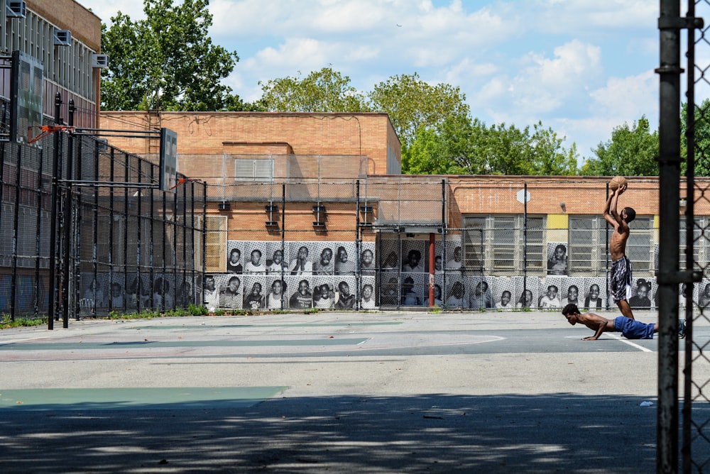 cars parked in front of brown building during daytime