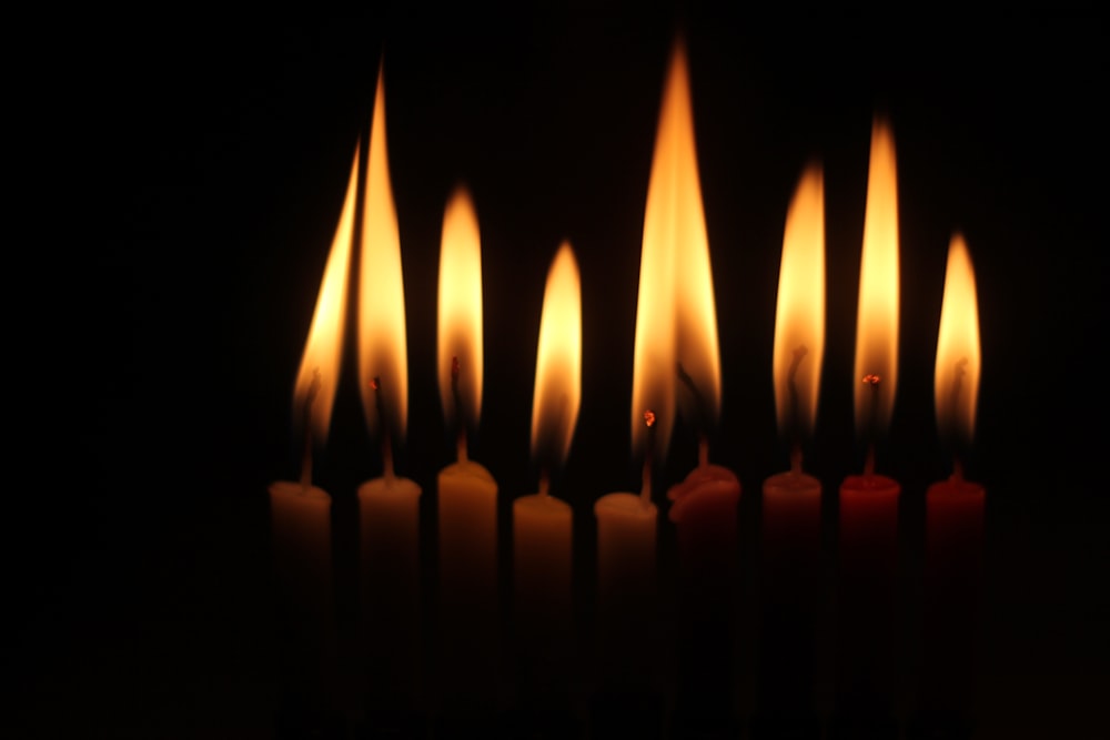 candles on black background with black background