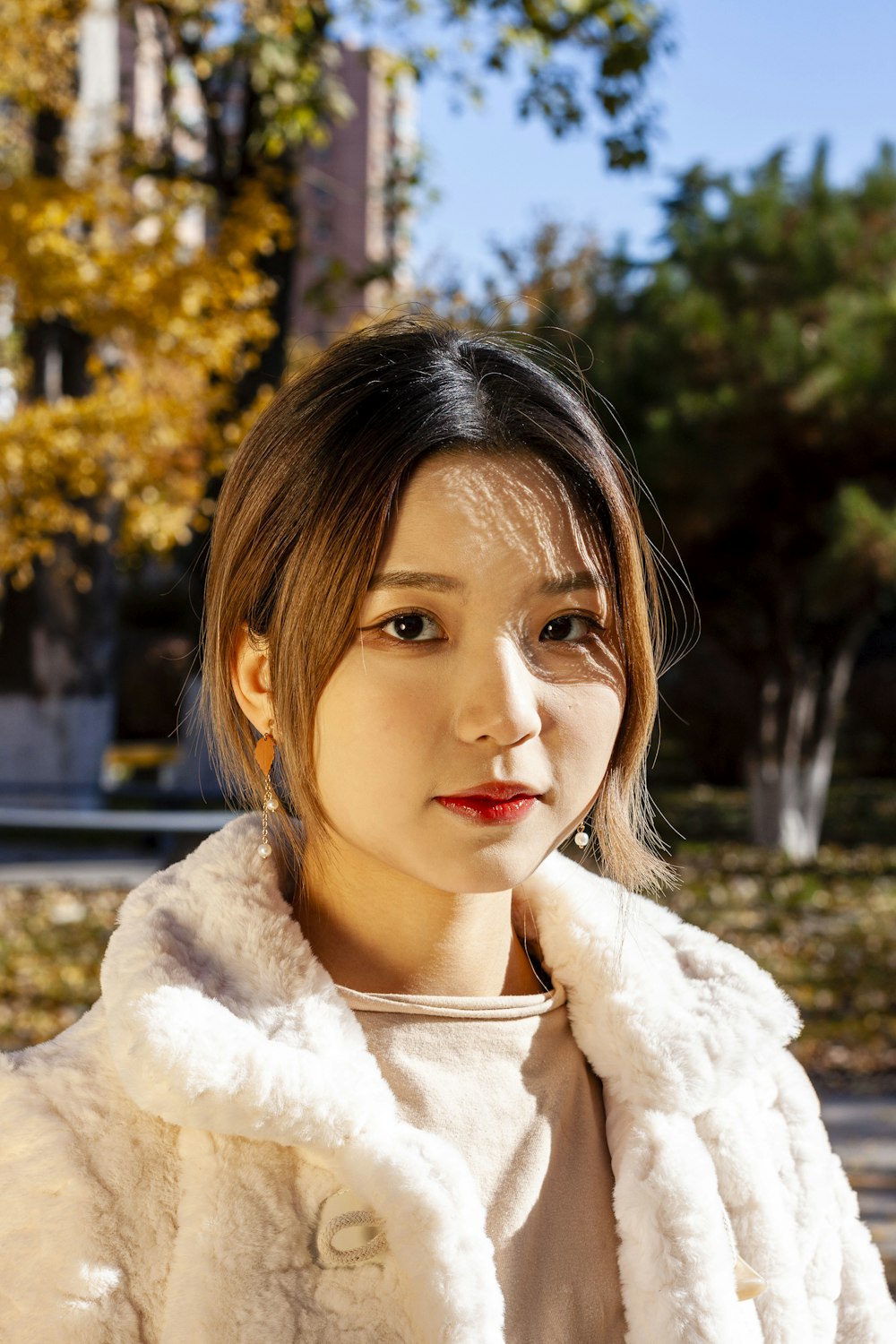 woman in white fur coat