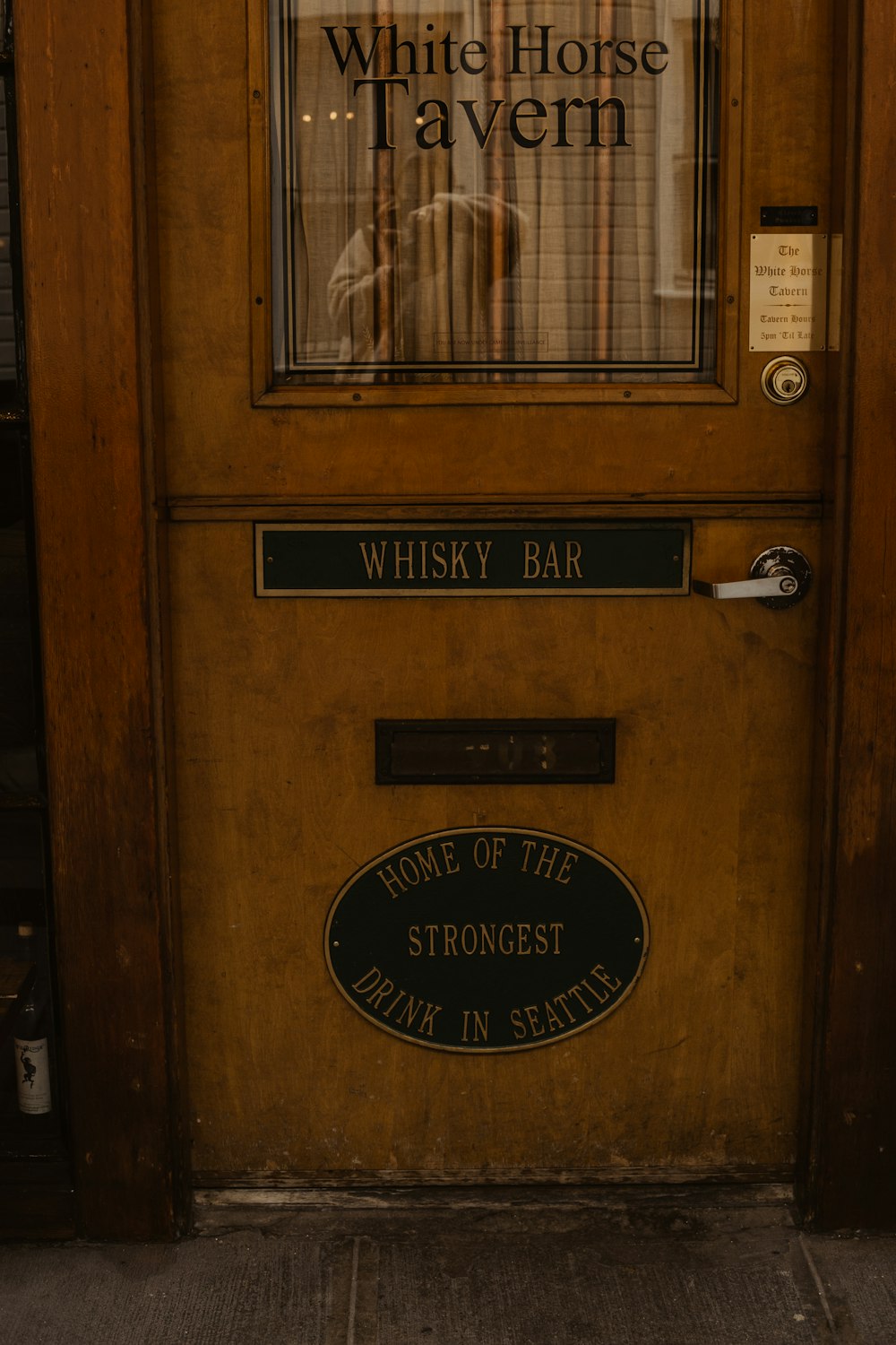 brown wooden cabinet with black door