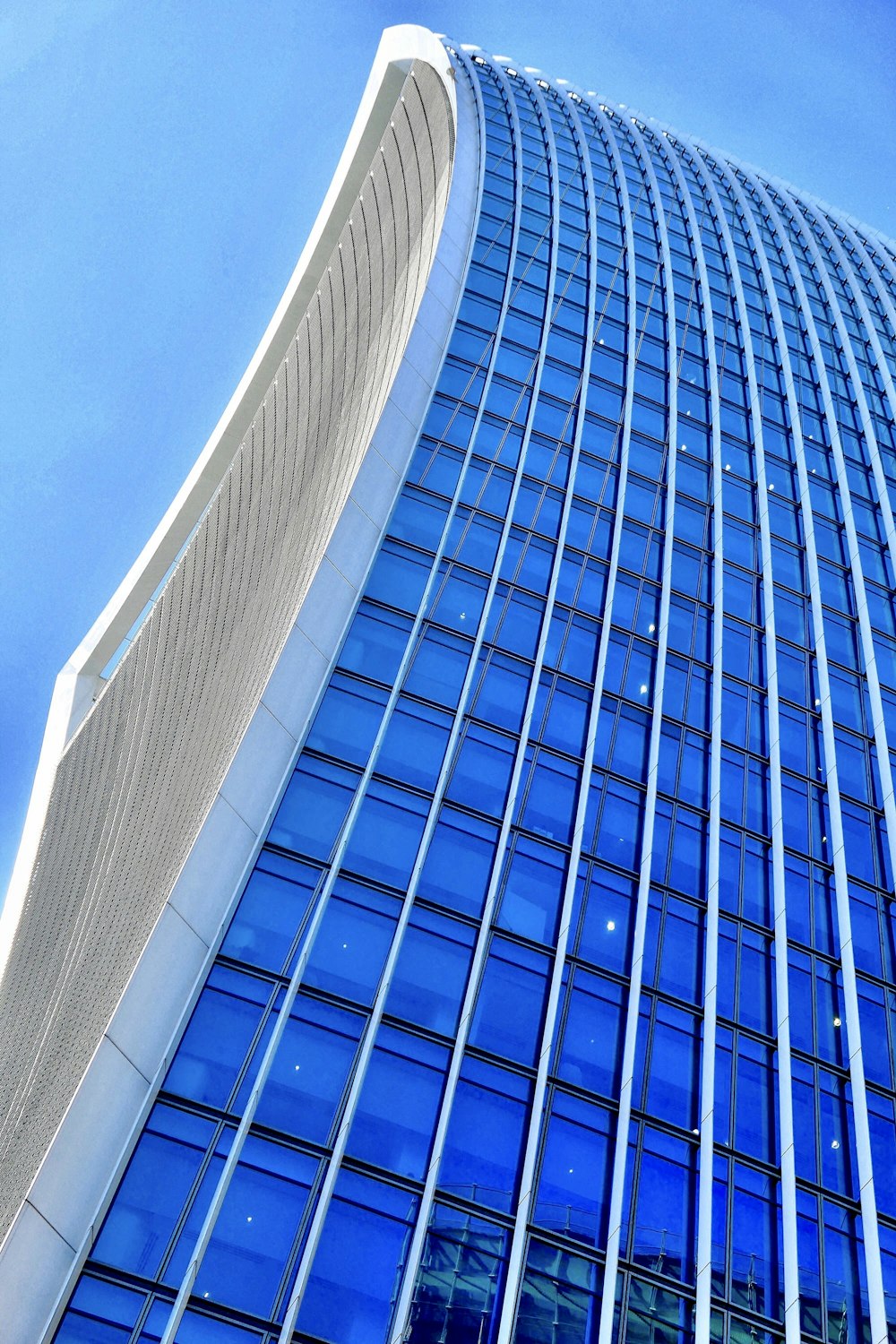 blue glass walled high rise building