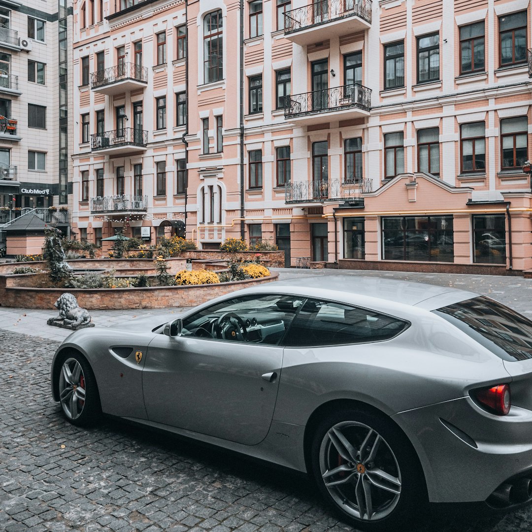 silver coupe parked on street during daytime