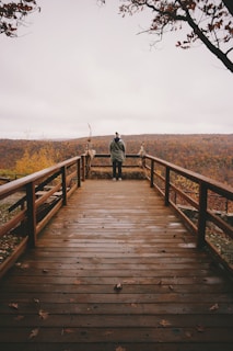 Deck view showing colorful fall leaves and distant ski slopes.