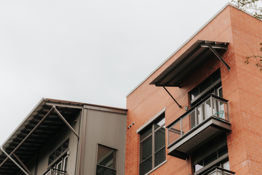 brown and white concrete building under white sky during daytime