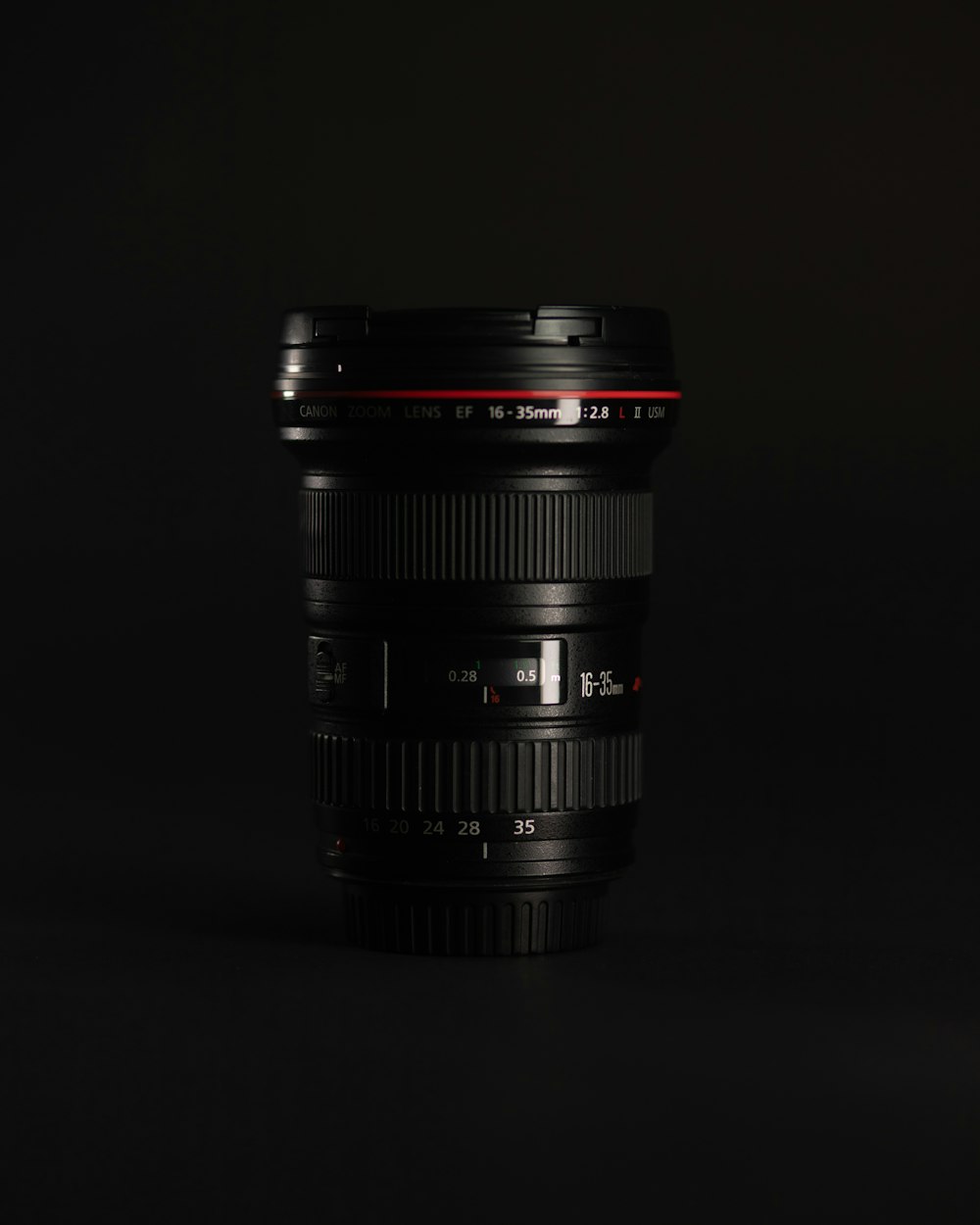 black camera lens on black background