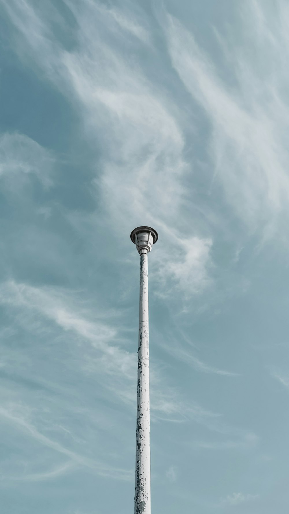 gray metal post under blue sky during daytime