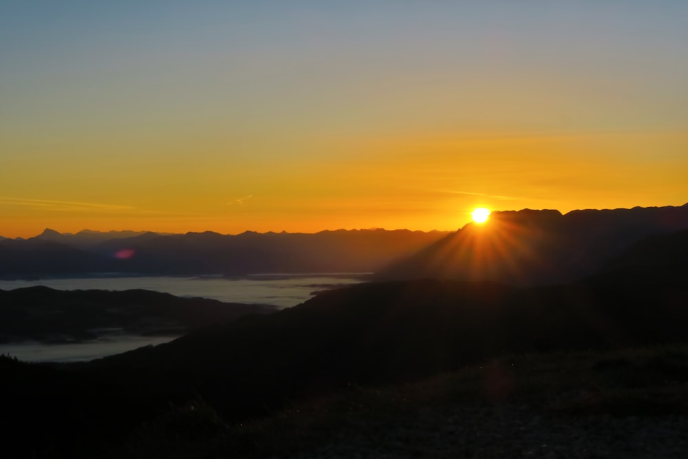 silhouette of mountain during sunset