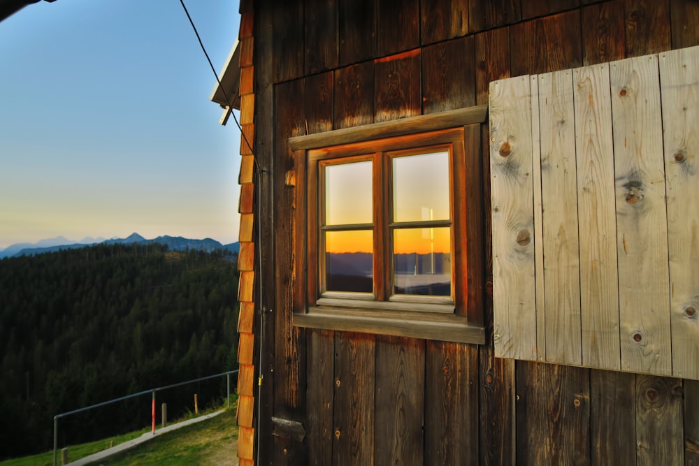 brown wooden framed glass window