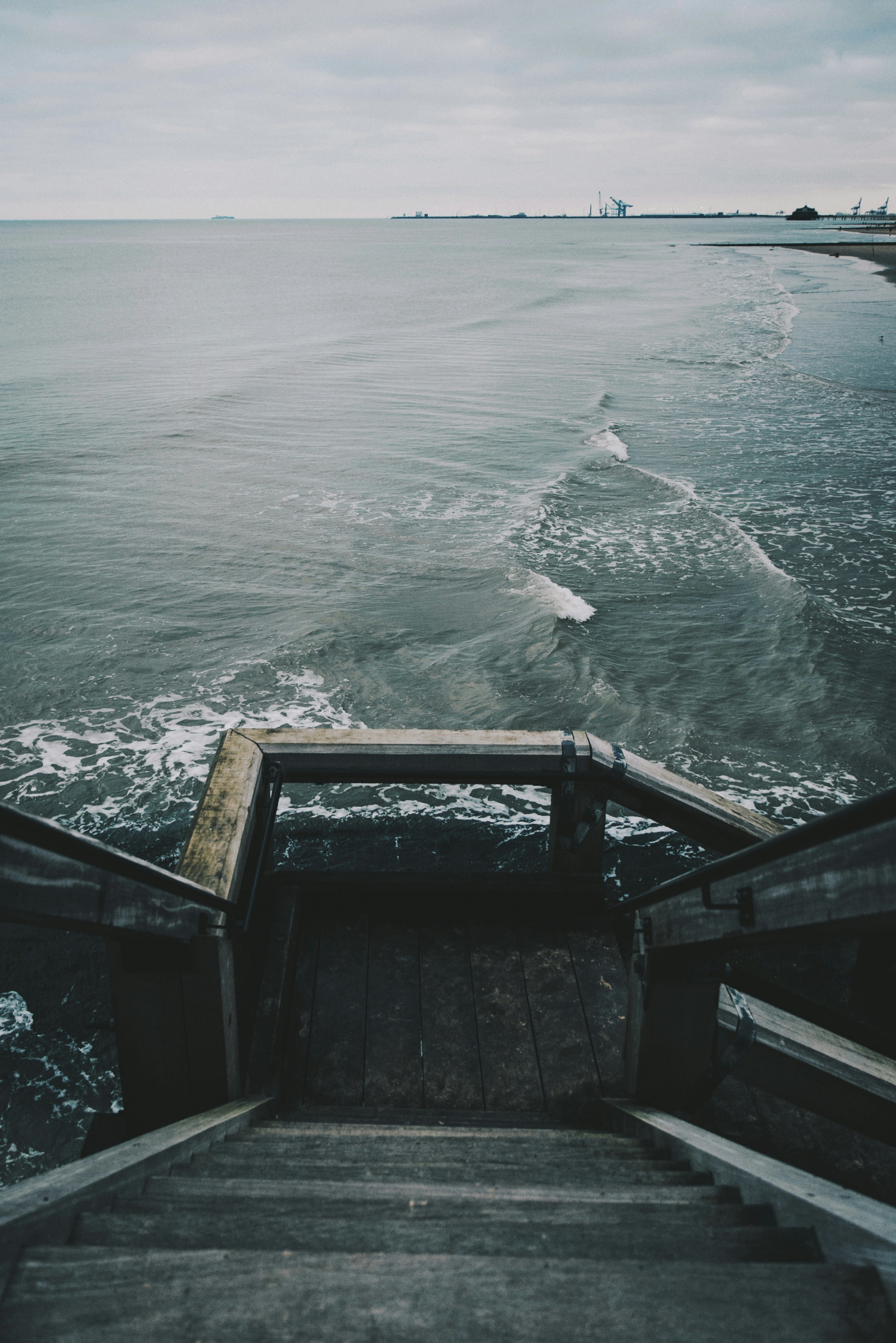 brown wooden dock over body of water during daytime