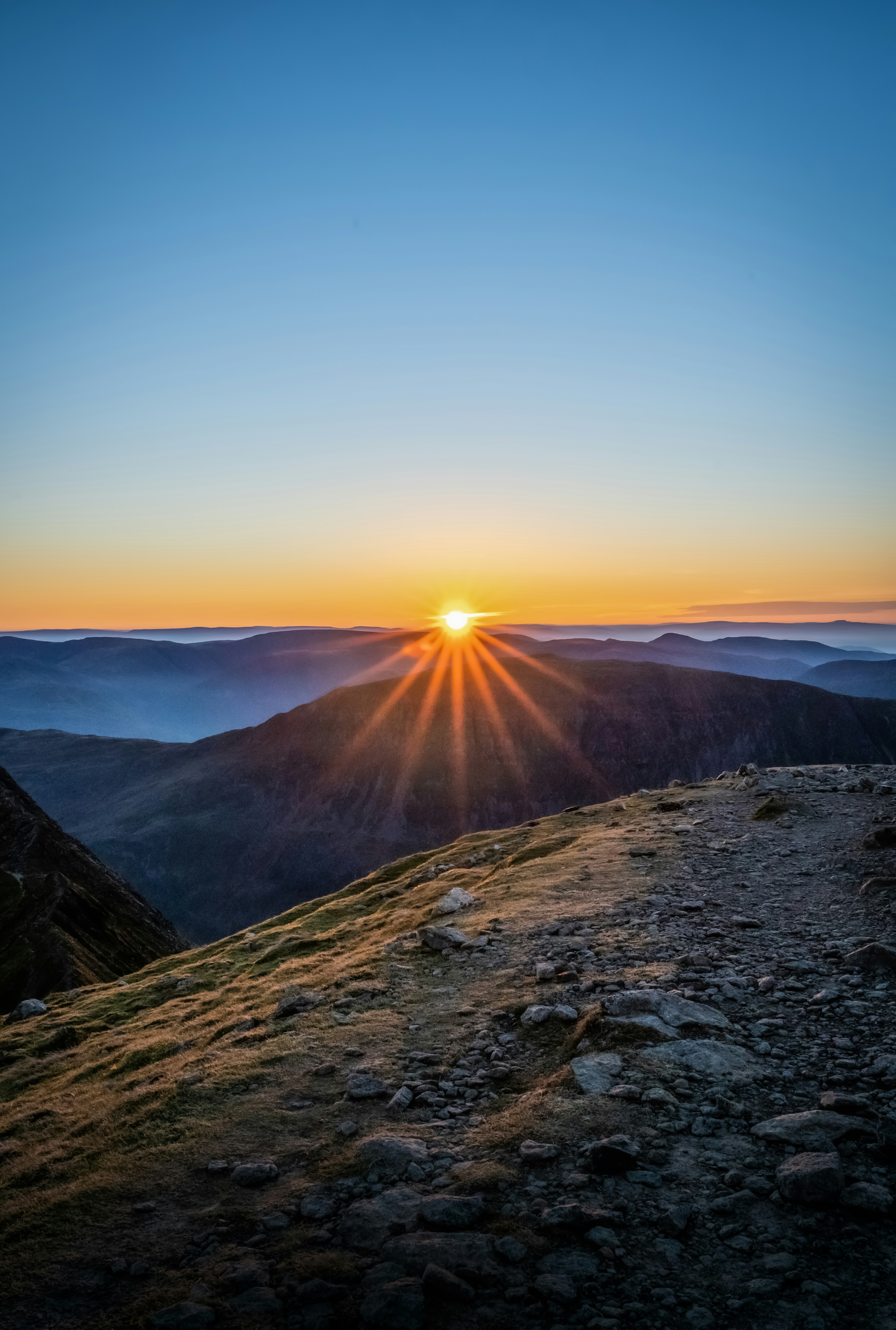 brown mountain under blue sky during daytime