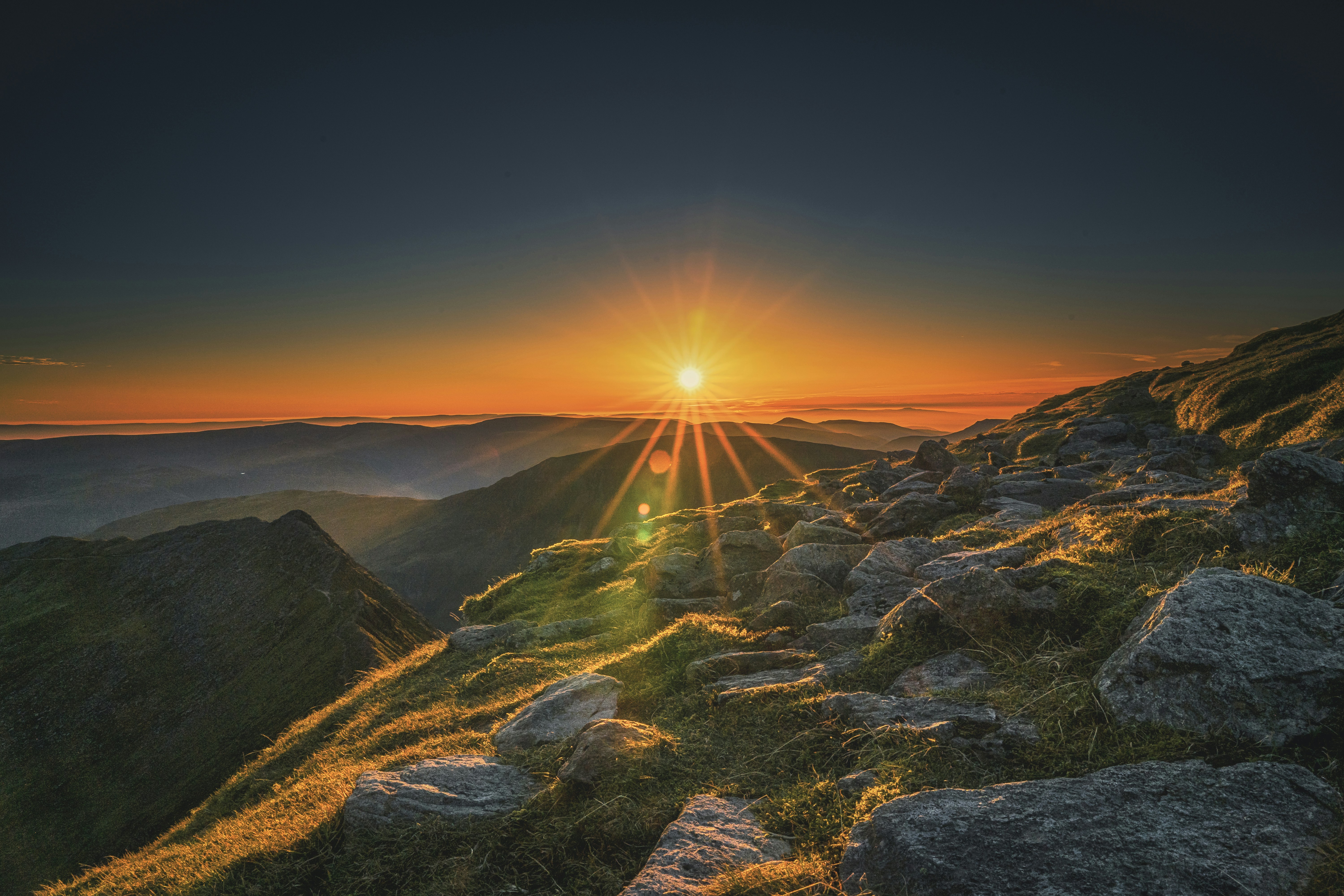 gray rocky mountain during sunset