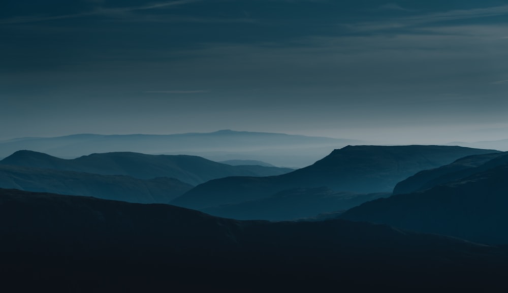 mountains under blue sky during daytime