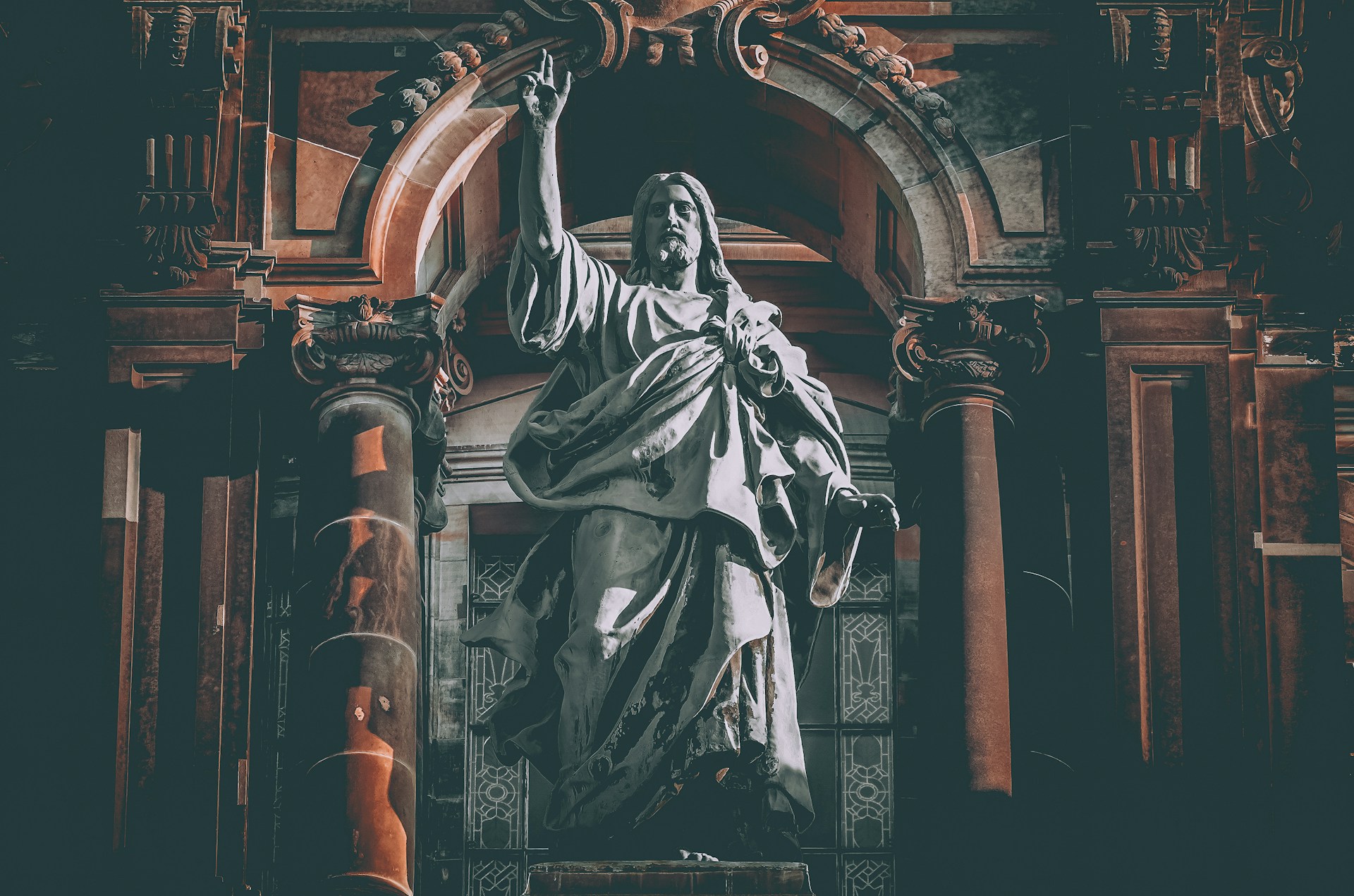 man in robe statue in cathedral