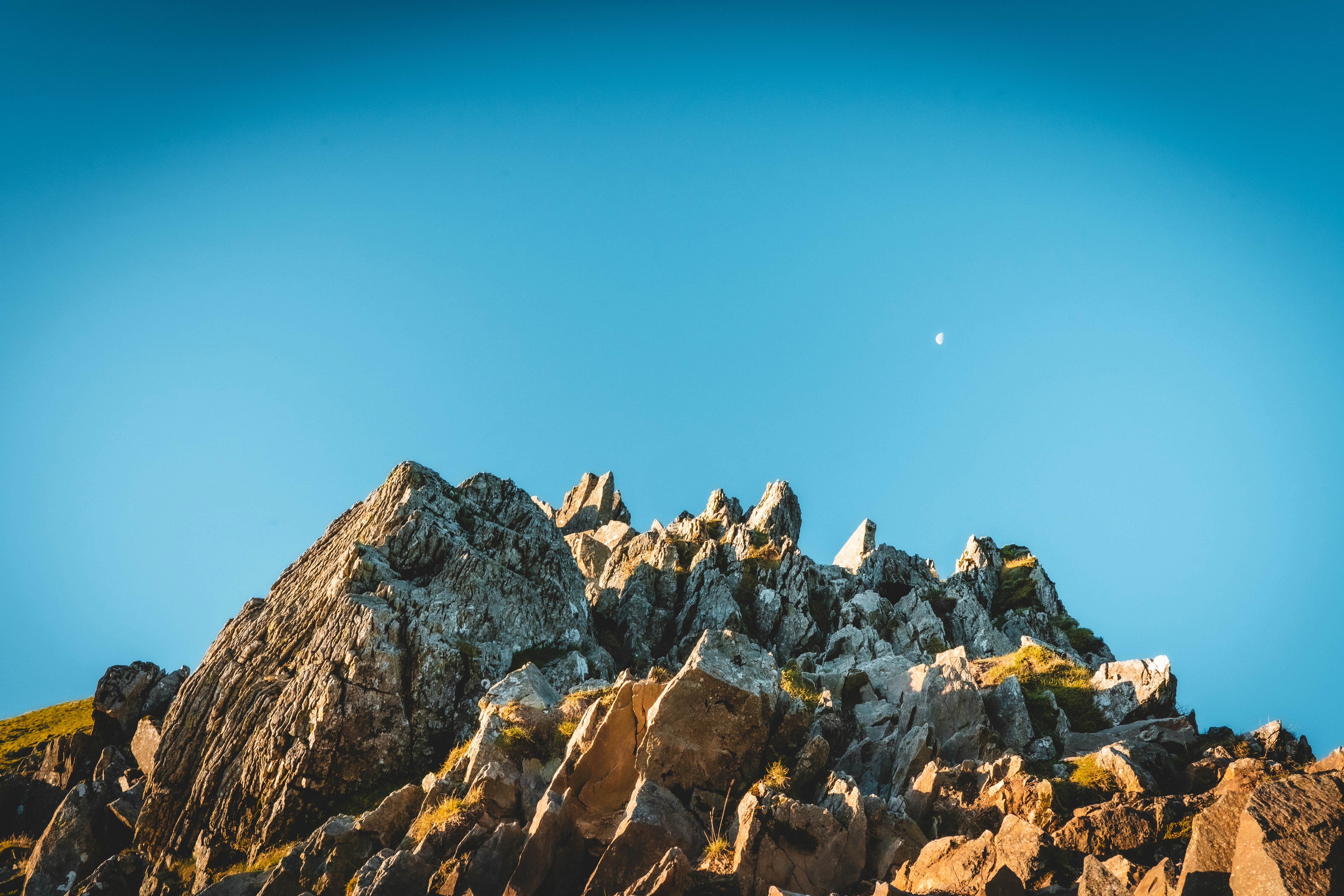 Brown rocky mountain under blue sky during daytime photo – Free Animal ...