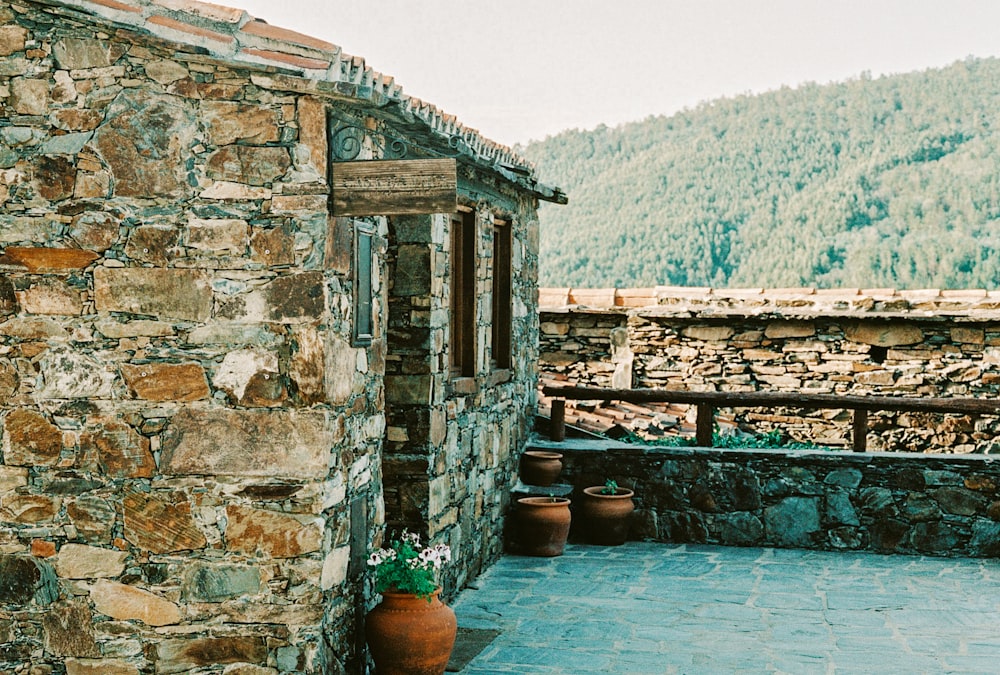 brown clay pot on swimming pool during daytime