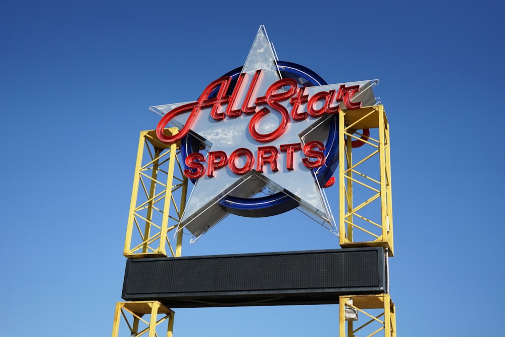 a sign for all star sports on a clear day