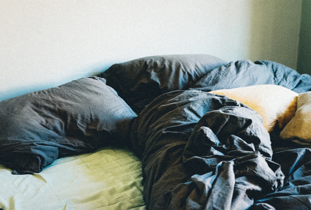 black and white blanket on bed