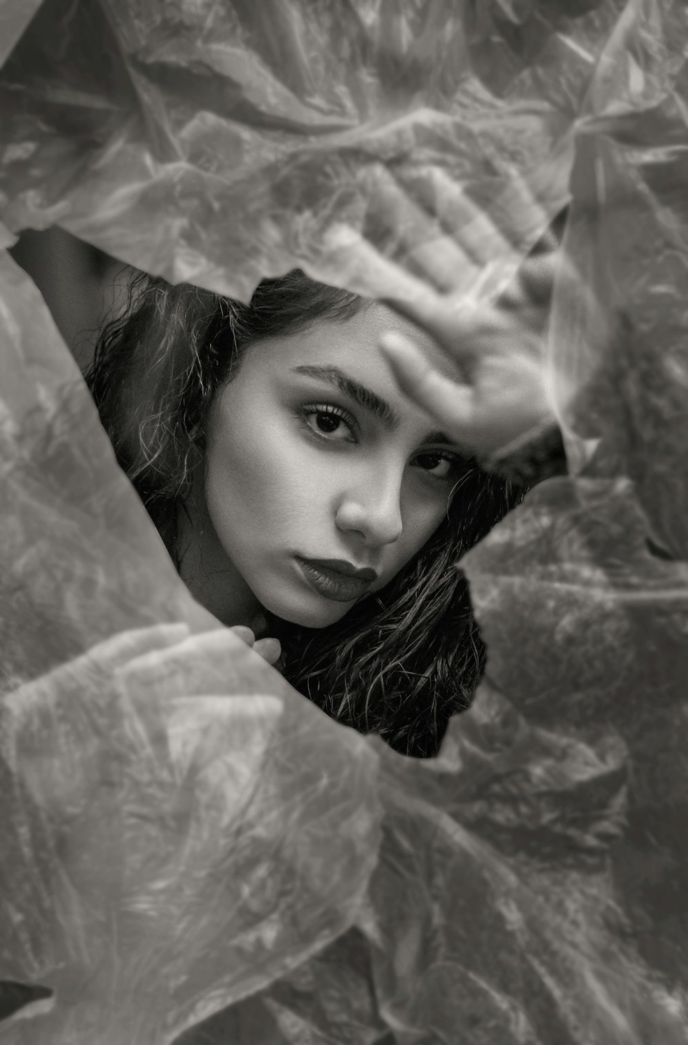 grayscale photo of woman in white sheer textile