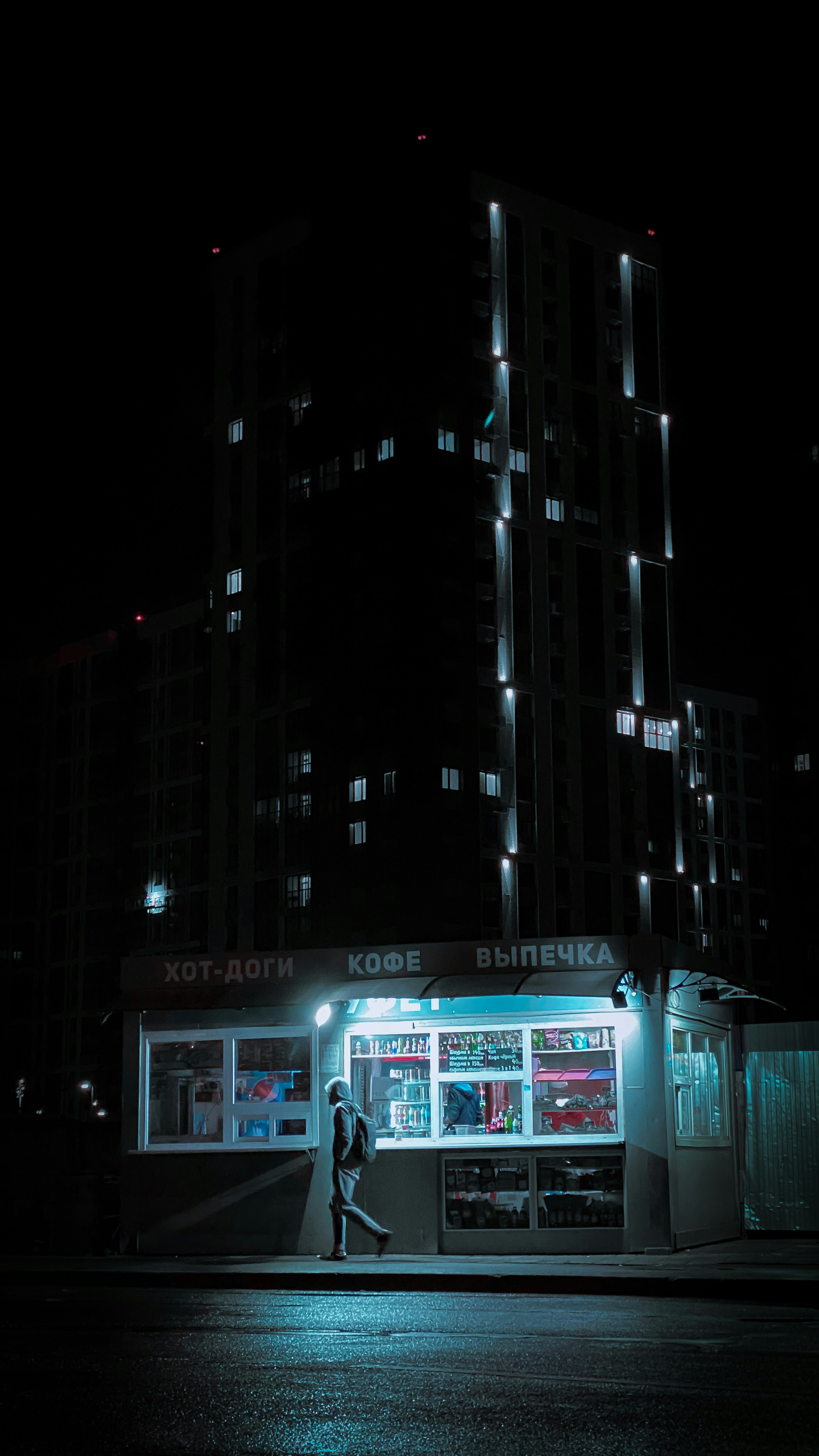 white-and-black-concrete-building-during-nighttime