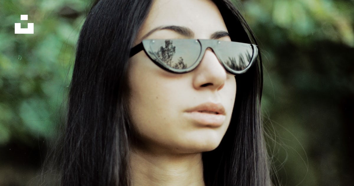 woman in black and brown leopard print shirt wearing black sunglasses ...