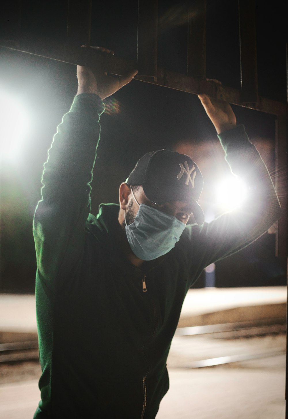 man in black hoodie wearing white goggles