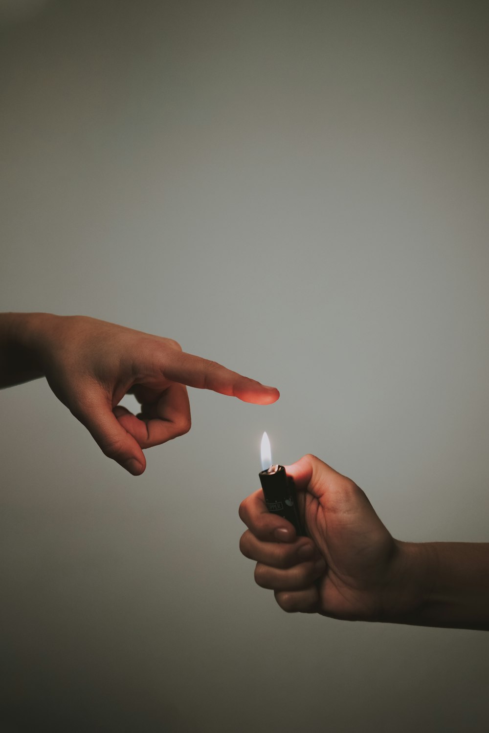 person holding black and white lighter