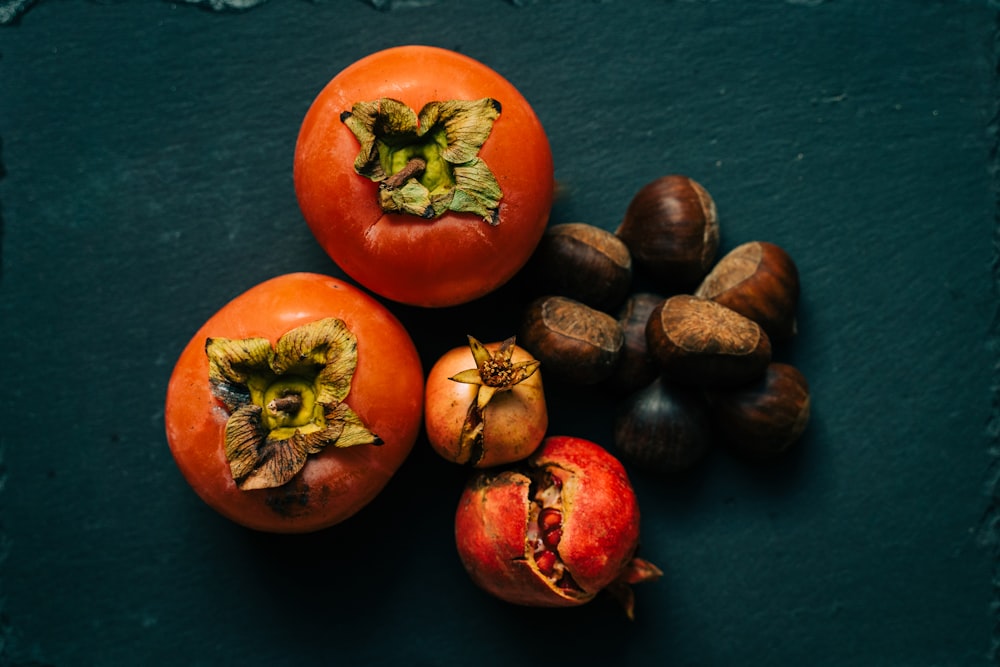 red round fruits on blue textile