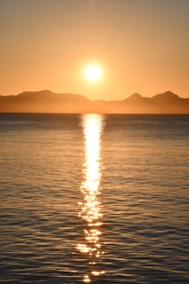 body of water during sunset
