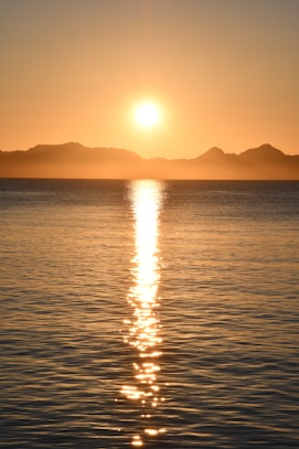 body of water during sunset