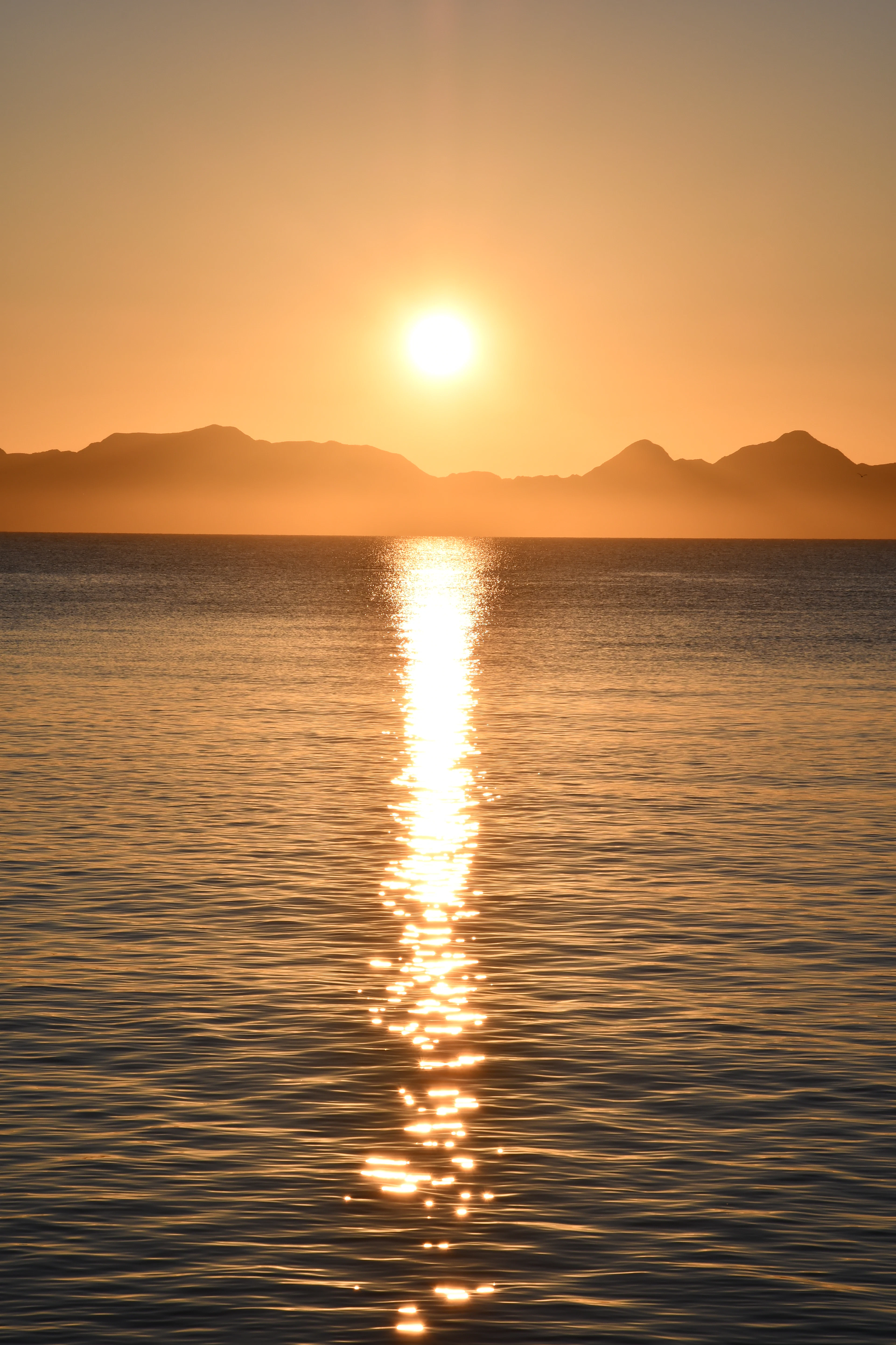 Sunrise over island silhouettes and the calm Sea of Cortez, Loreto, Mexico