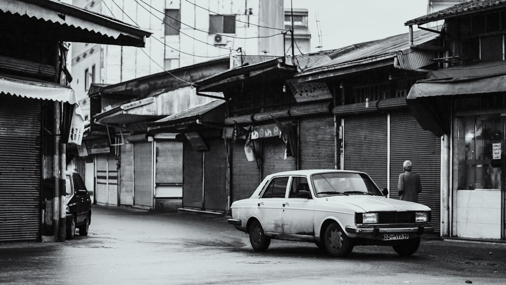 white suv parked beside building