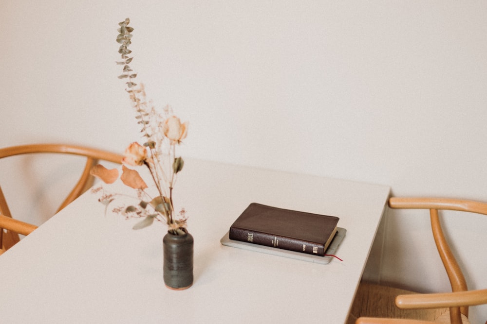 black laptop computer on white table