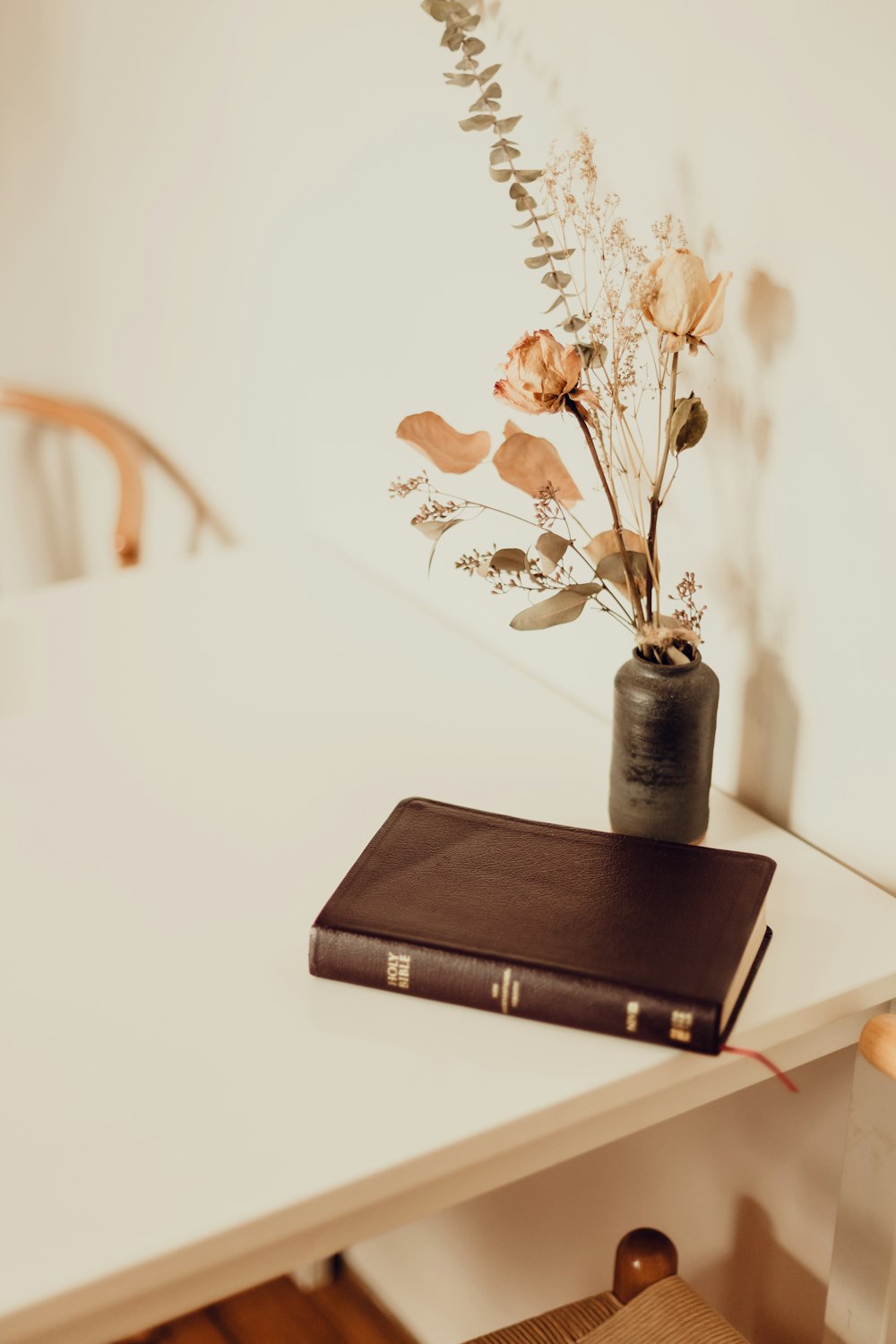 black hardbound book on white table