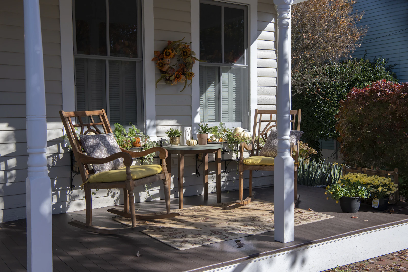 Wooden front porch with seating on a Grass Valley CA starter home in the Sierra Foothills