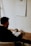 man in black long sleeve shirt sitting at the table