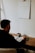 man in black long sleeve shirt sitting at the table