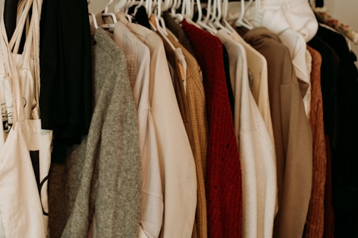 A variety of garments showcased on hangers.
