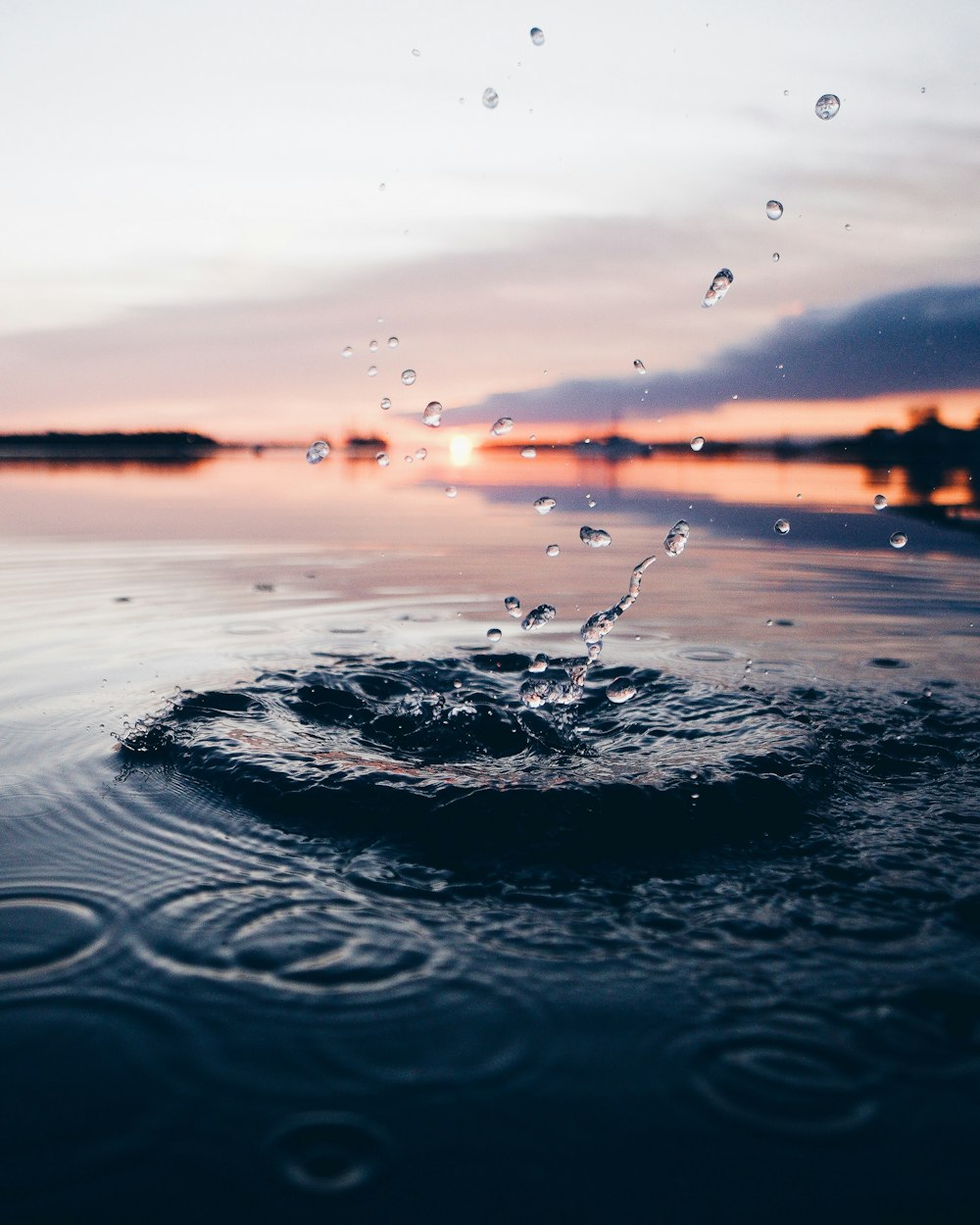 body of water during sunset