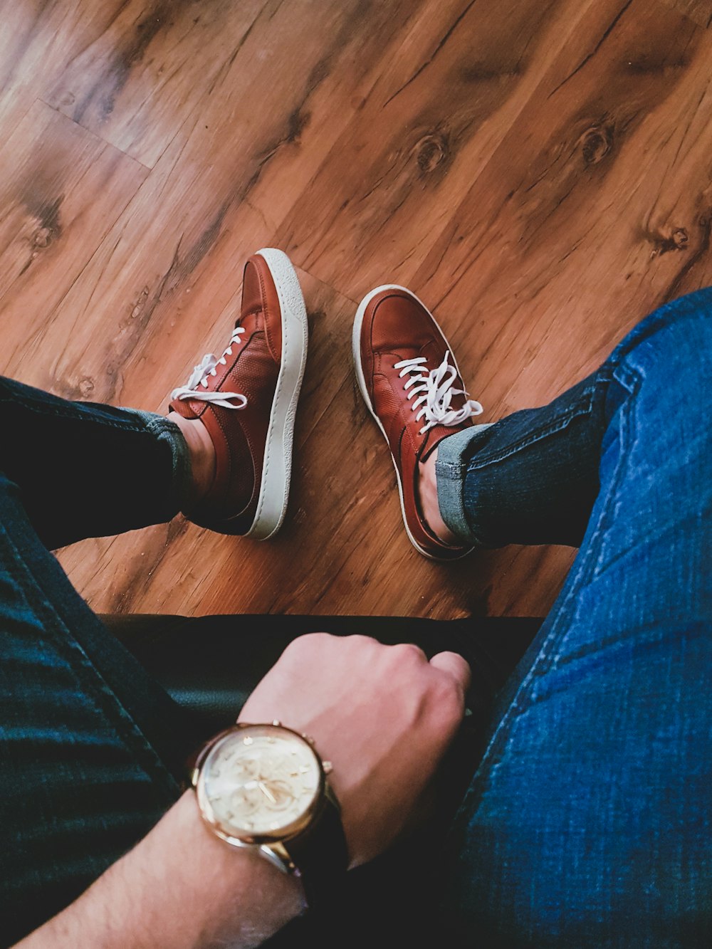 person wearing black and white sneakers