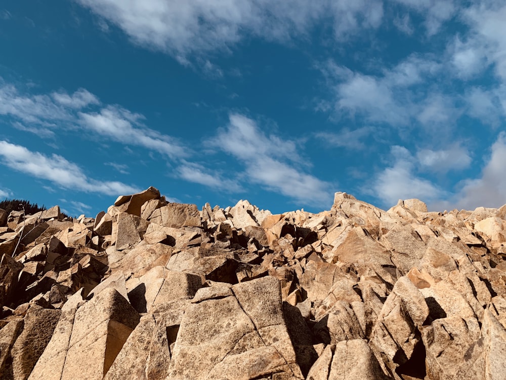 brown rocky mountain under blue sky during daytime