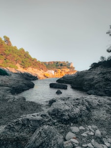 A serene coastal landscape showcasing a traditional village by the sea.