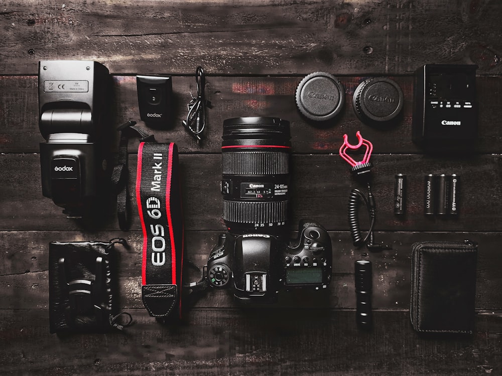 black and red nikon dslr camera