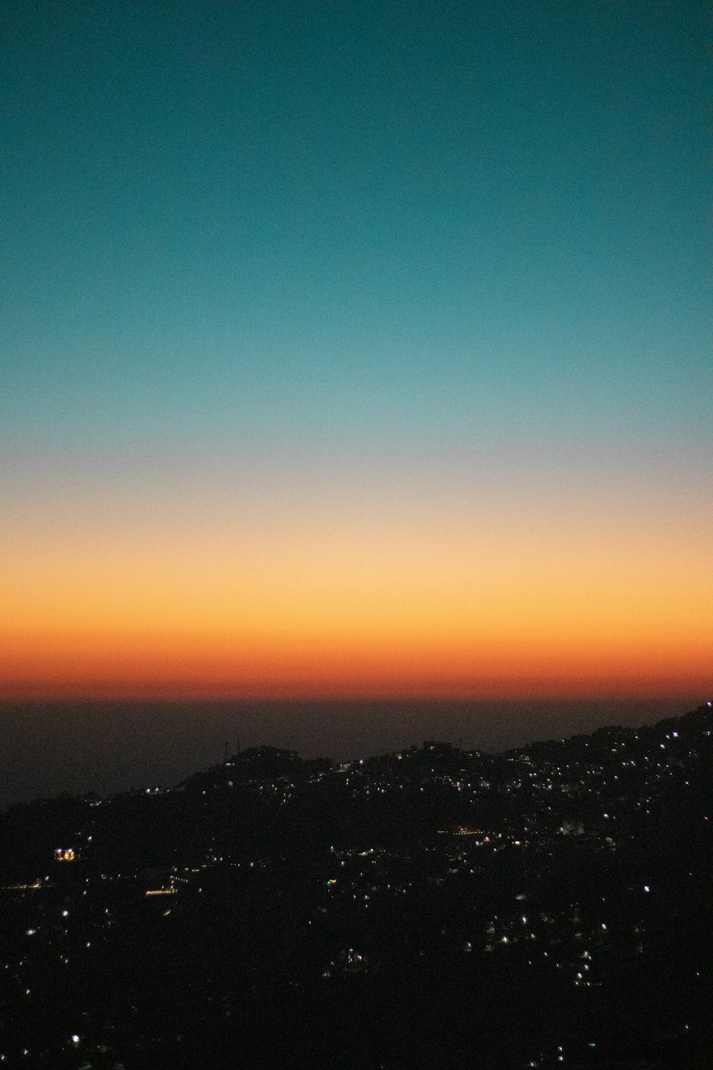 silhouette of mountains during sunset