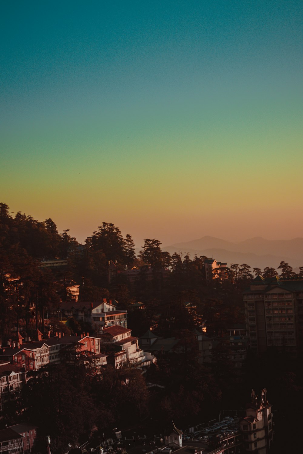 city with high rise buildings during sunset