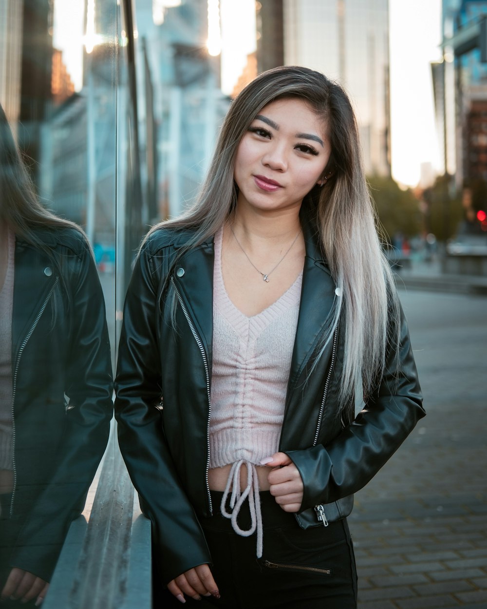 Woman in black leather jacket standing on sidewalk during daytime photo –  Free Vancouver Image on Unsplash