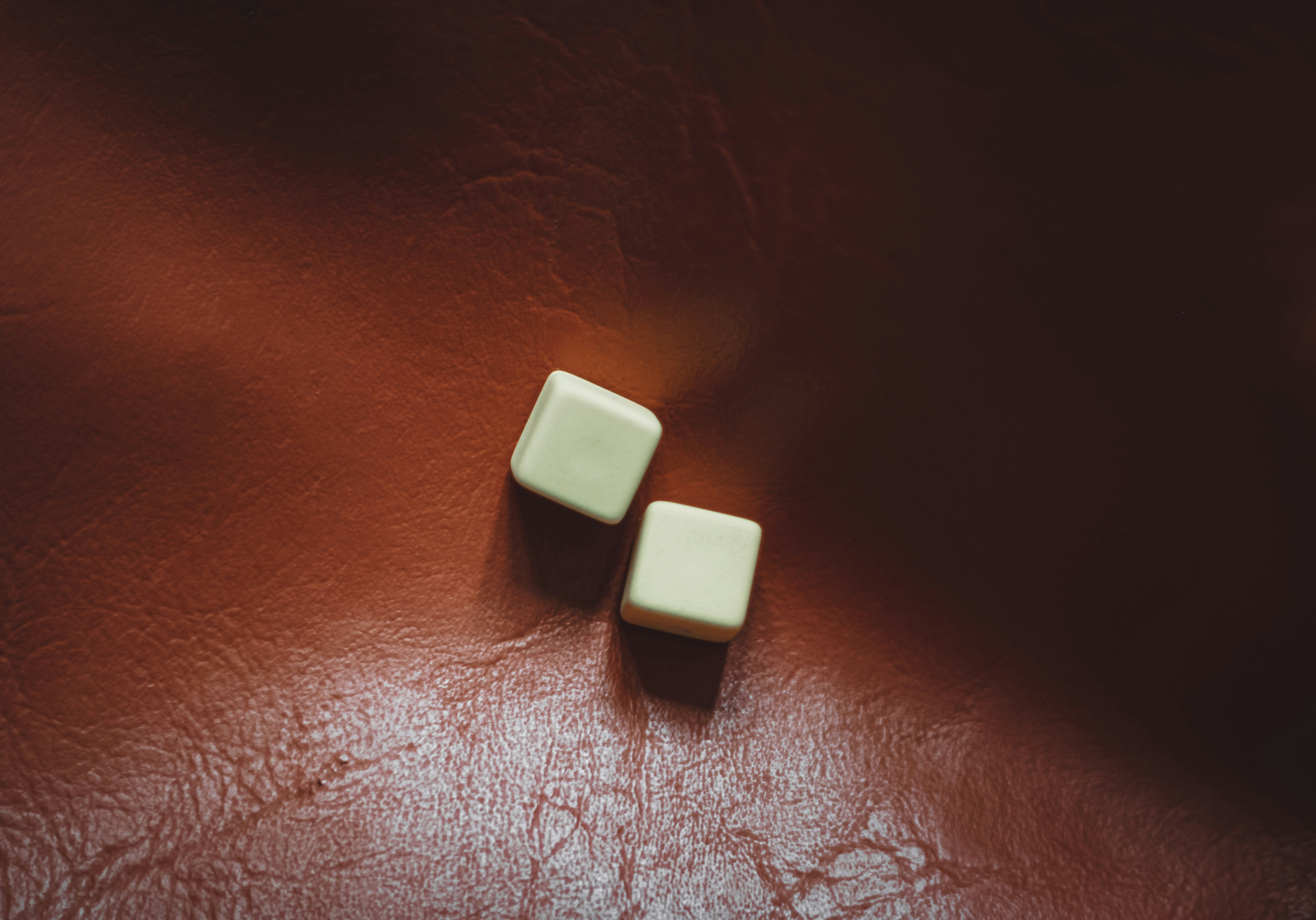 white square on red leather, Chance.