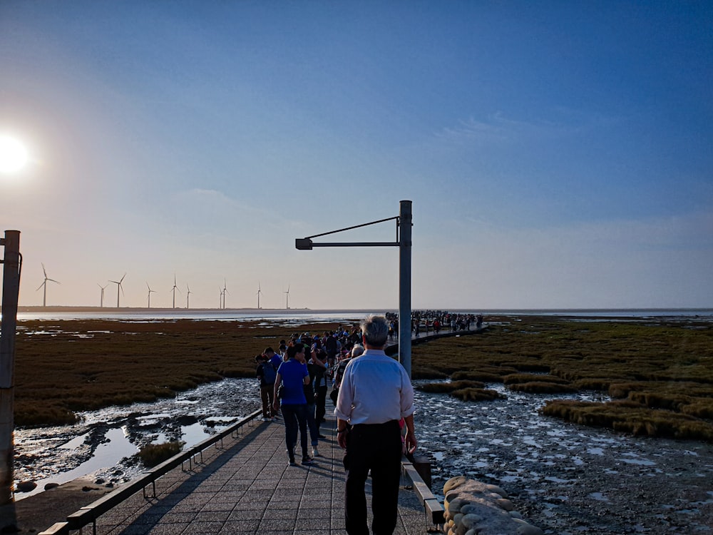 people walking on wooden dock during daytime