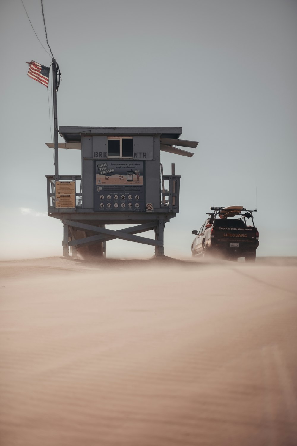 black and brown car on gray metal tower