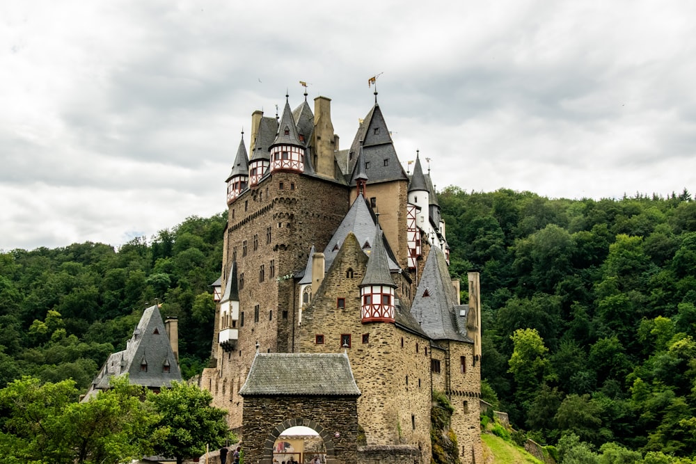 brown concrete castle under white clouds during daytime